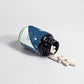 Alpha Energy vitamins bottle with pills spilling out on a light gray background