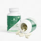 Supplement bottle labeled 'Digestive Enzyme Pro Blend' with capsules spilling out on a white background